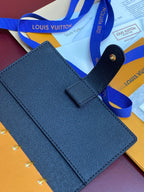 Blue Louis Vuitton small bag with open flap and top strap detail