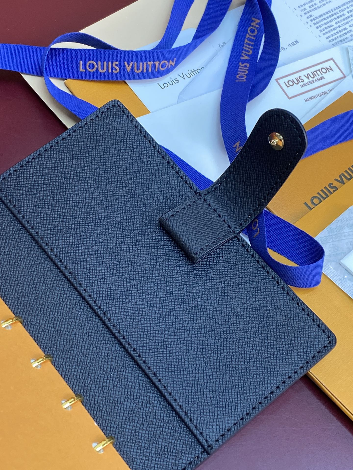 Blue Louis Vuitton small bag with open flap and top strap detail