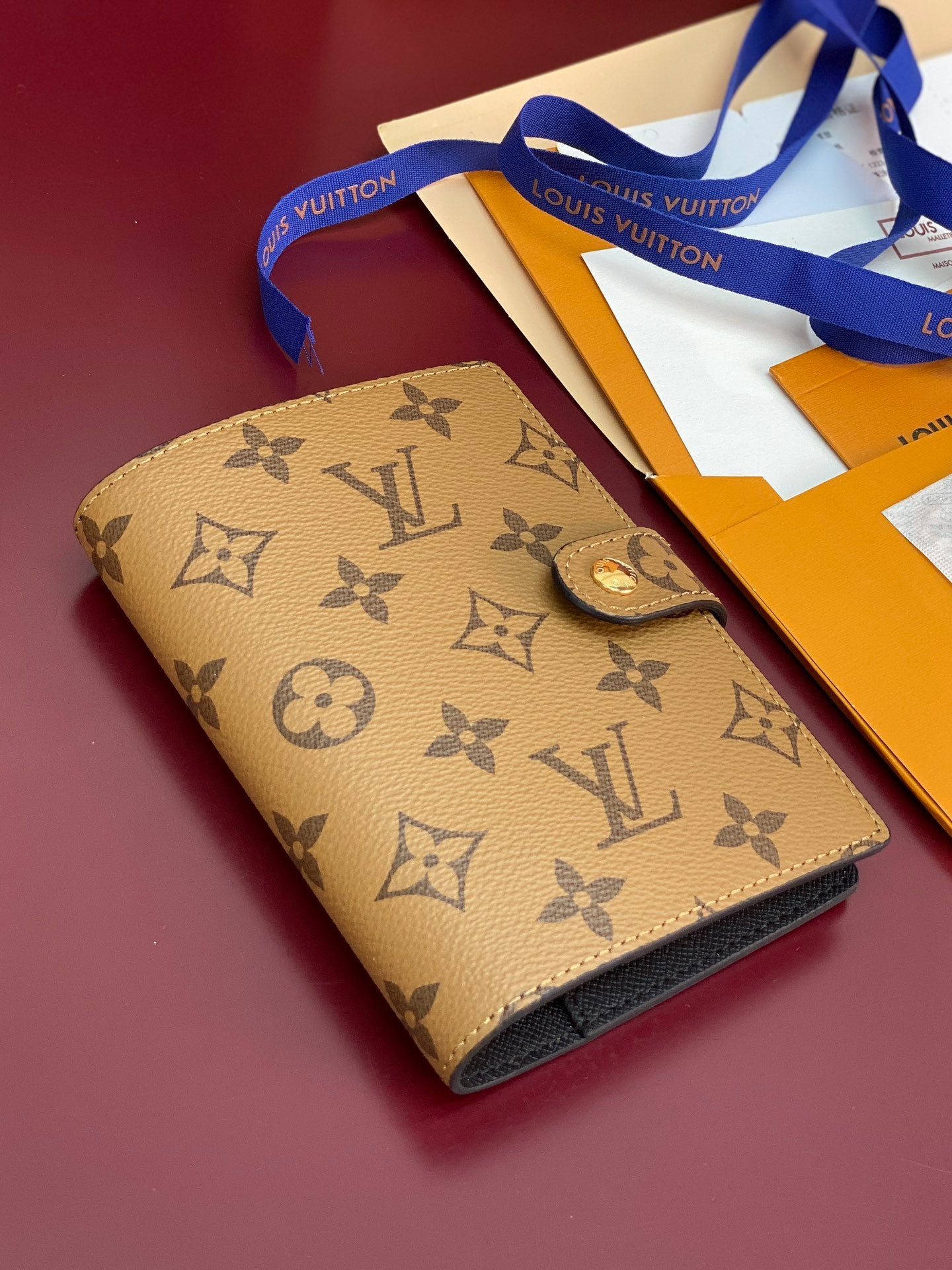 Small bag with tan Louis Vuitton monogram and fold-over flap