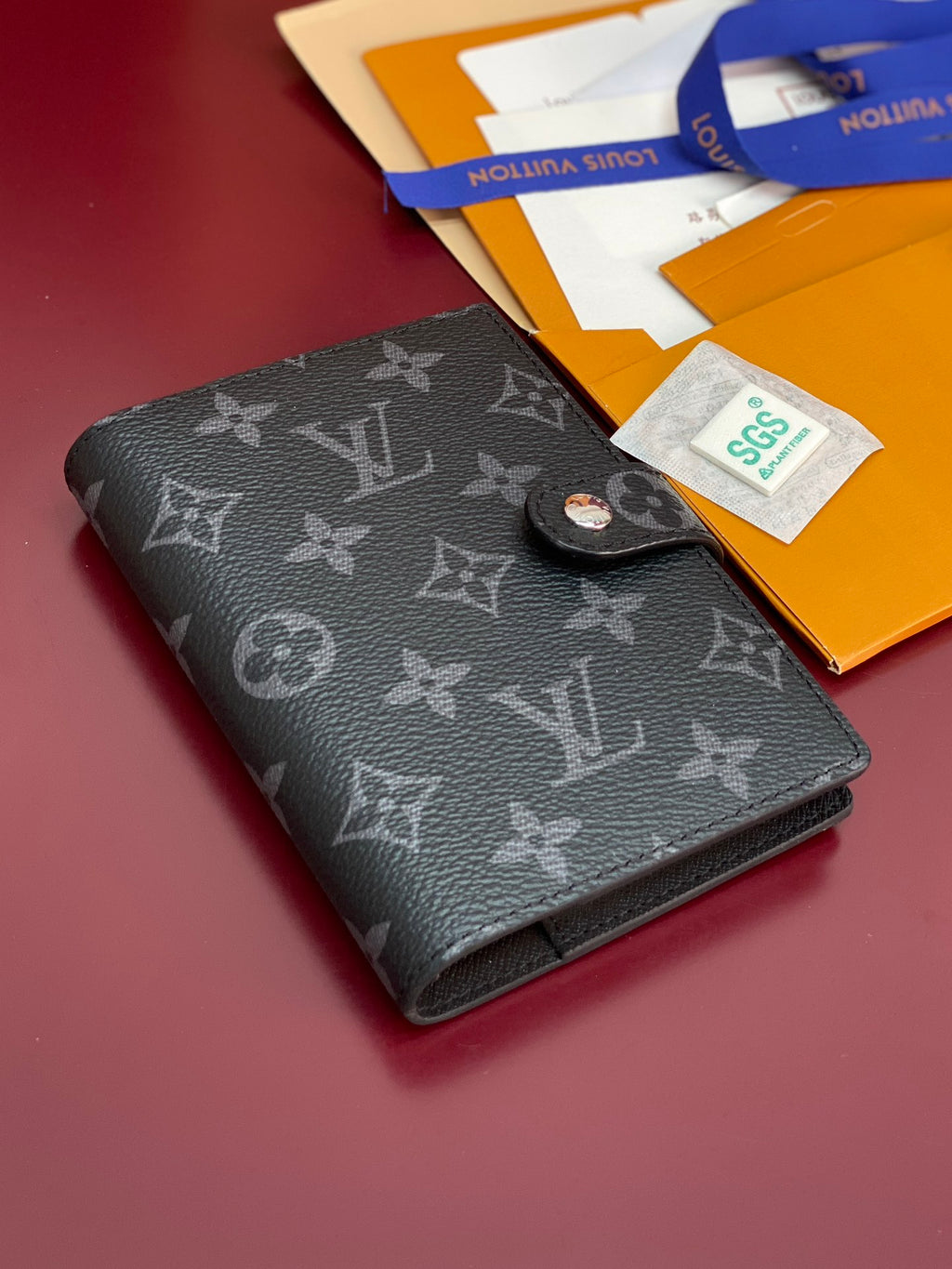 Louis Vuitton small bag, dark monogram cardholder with button tab and folded pages