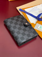 Louis Vuitton small bag with dark checkered front and round snap button