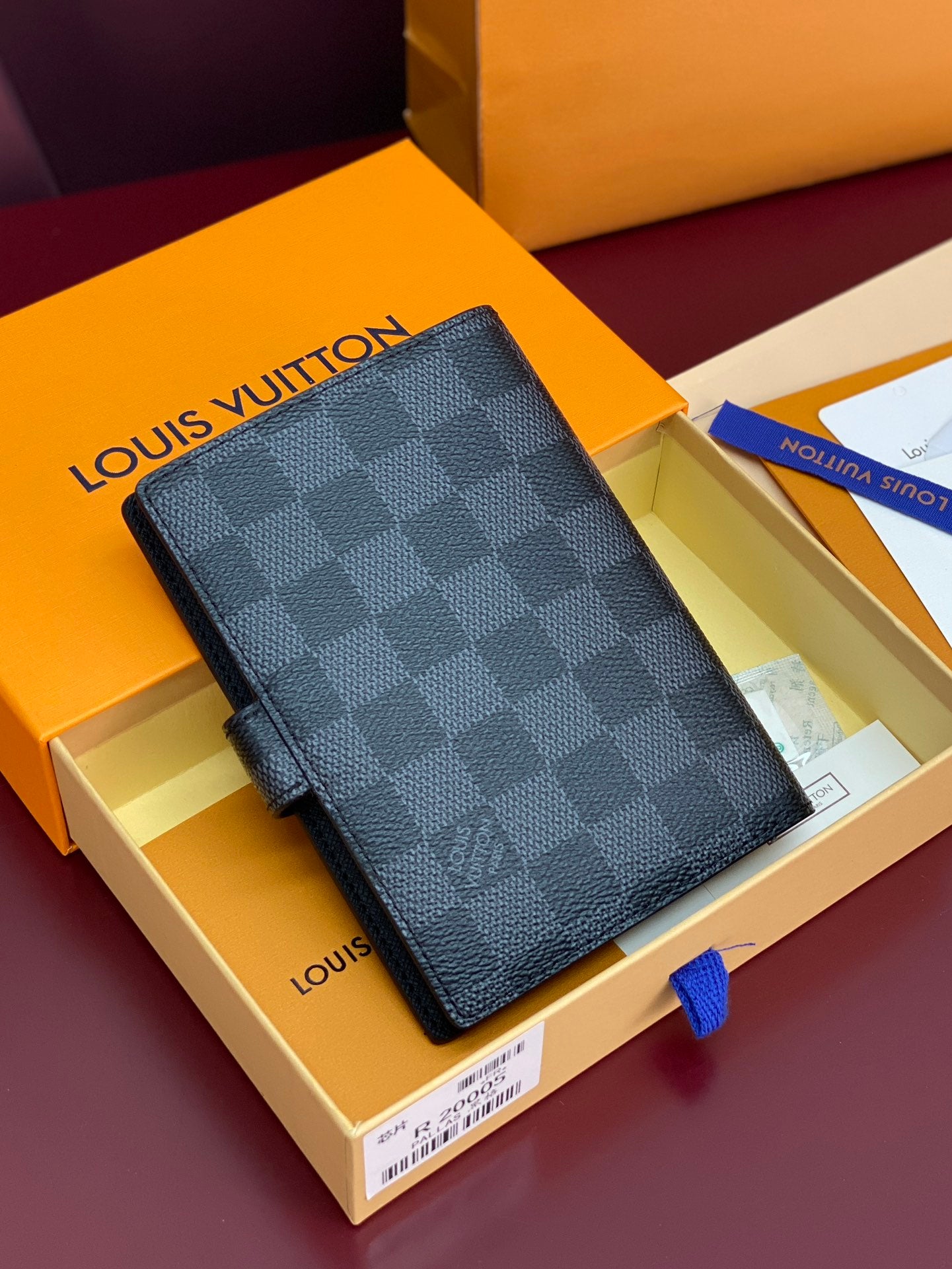 Louis Vuitton small bag in dark checkered fabric with front snap closure