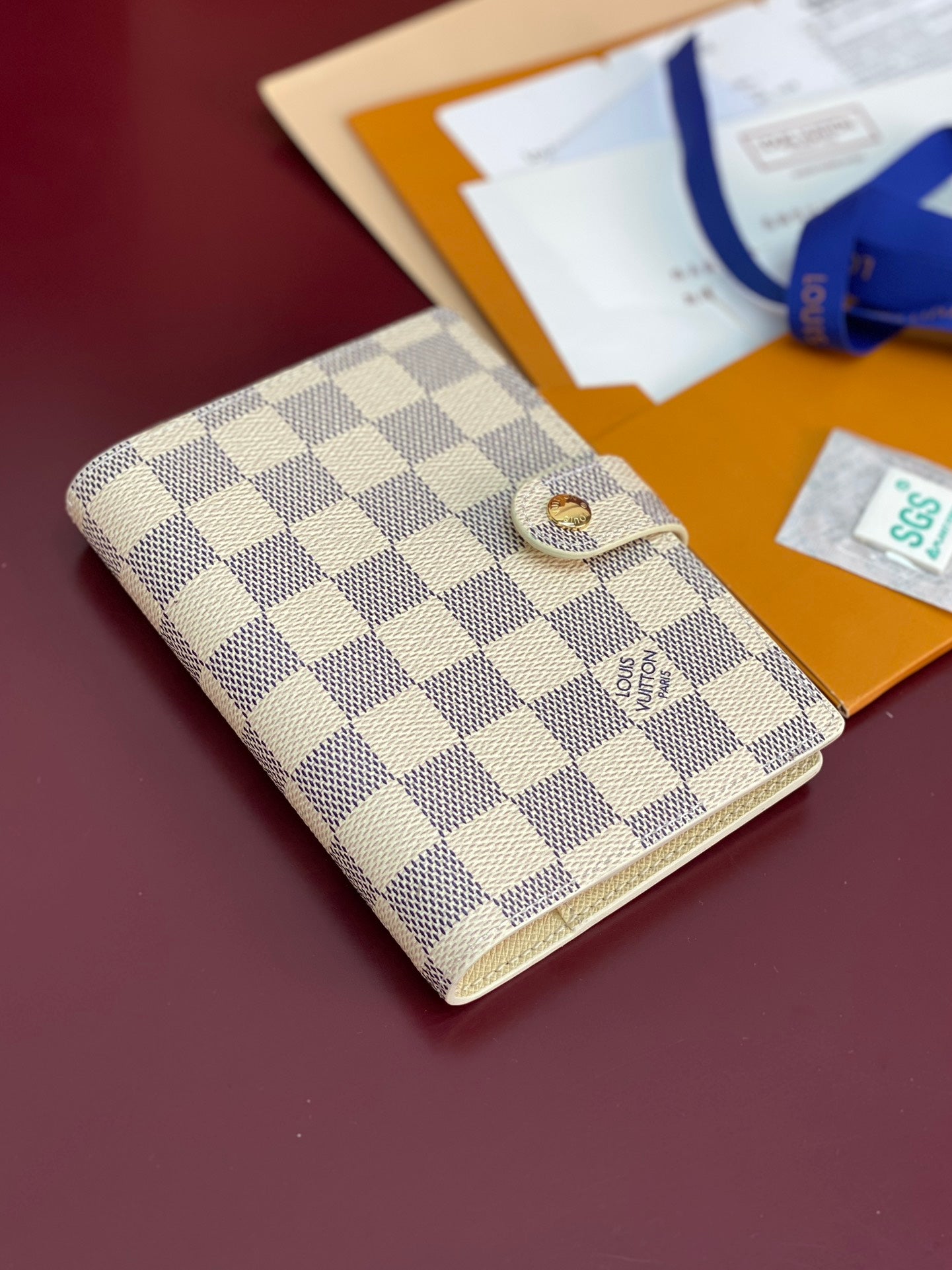 Checkered small wallet bag with snap button front and textured fabric with gold clasp