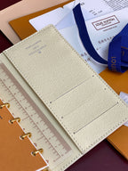 Ivory small ring binder cover with stitched lines and small embossed logo