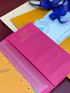 Small bag planner with magenta cover and SGS tag on an open insert