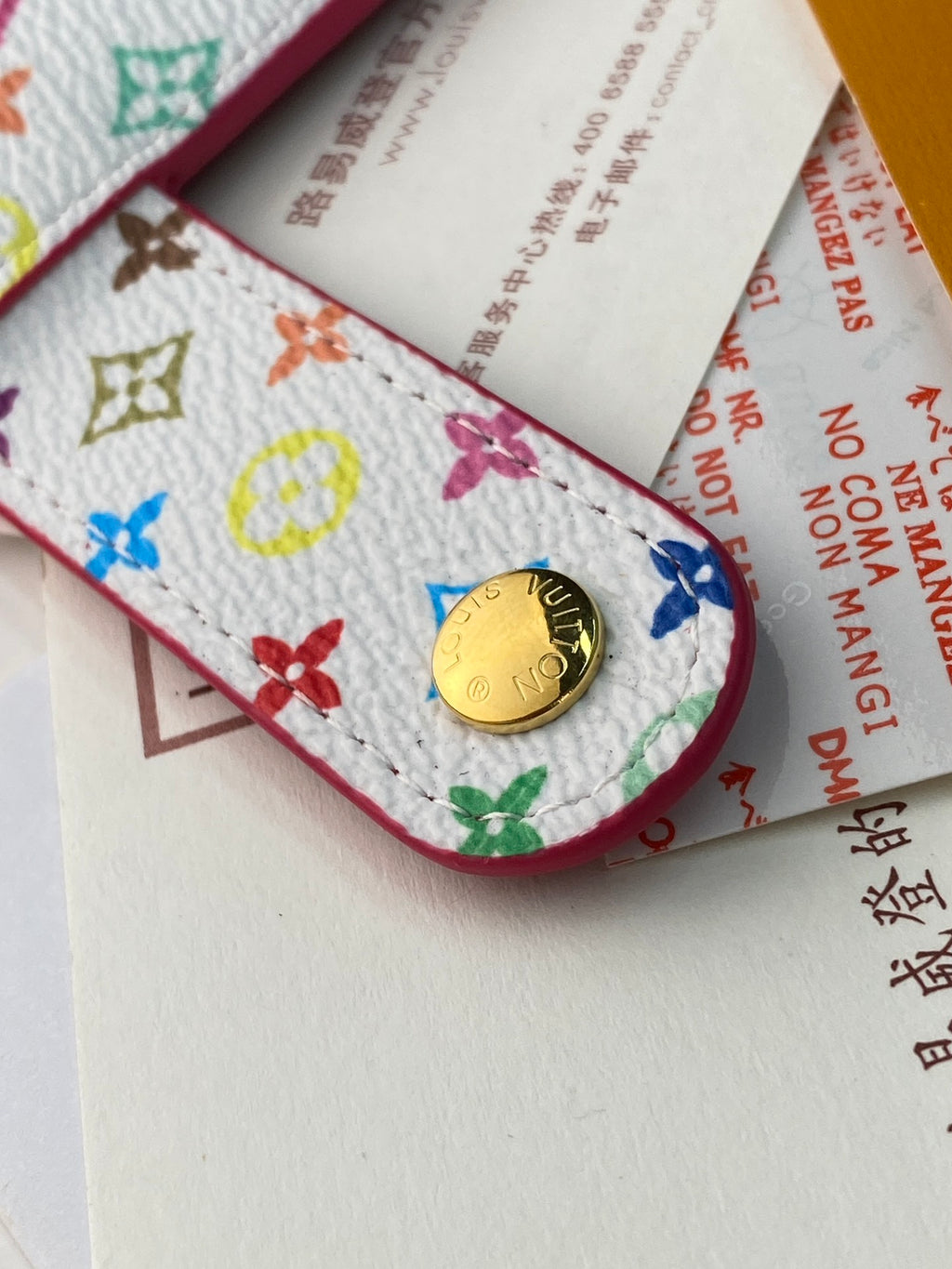 Small bag with multicolor logo canvas, red trim, coin pocket