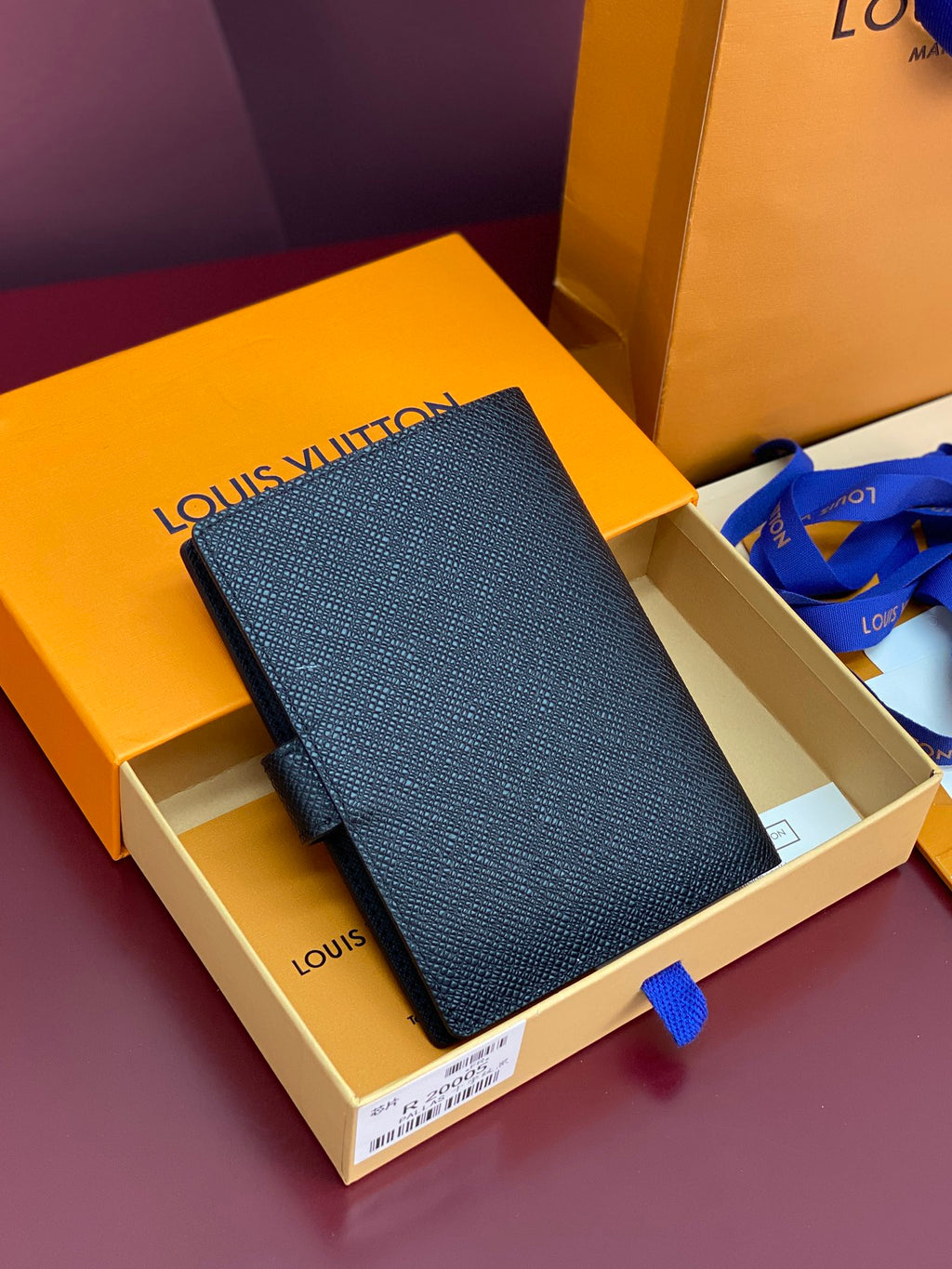 Louis Vuitton small bag, dark blue textured finish, front flap and snap closure