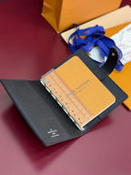 Louis Vuitton small bag open with ruler insert, dark blue textured leather and strap