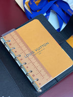 Louis Vuitton small bag open, ruler insert visible under clear cover panel