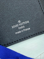 Louis Vuitton small bag interior label, black textured leather with “made in France” text.