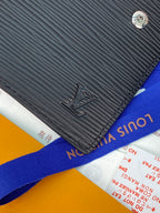 Small bag with black textured finish and embossed logo, plus blue web strap