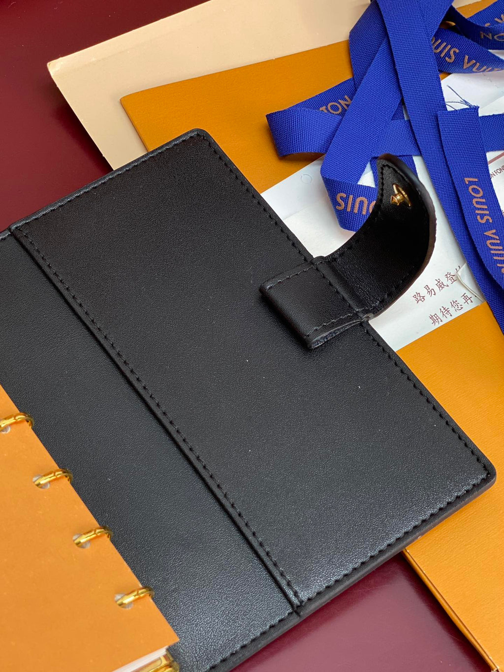 Small Louis Vuitton leather agenda with strap and blank cover, dark blue