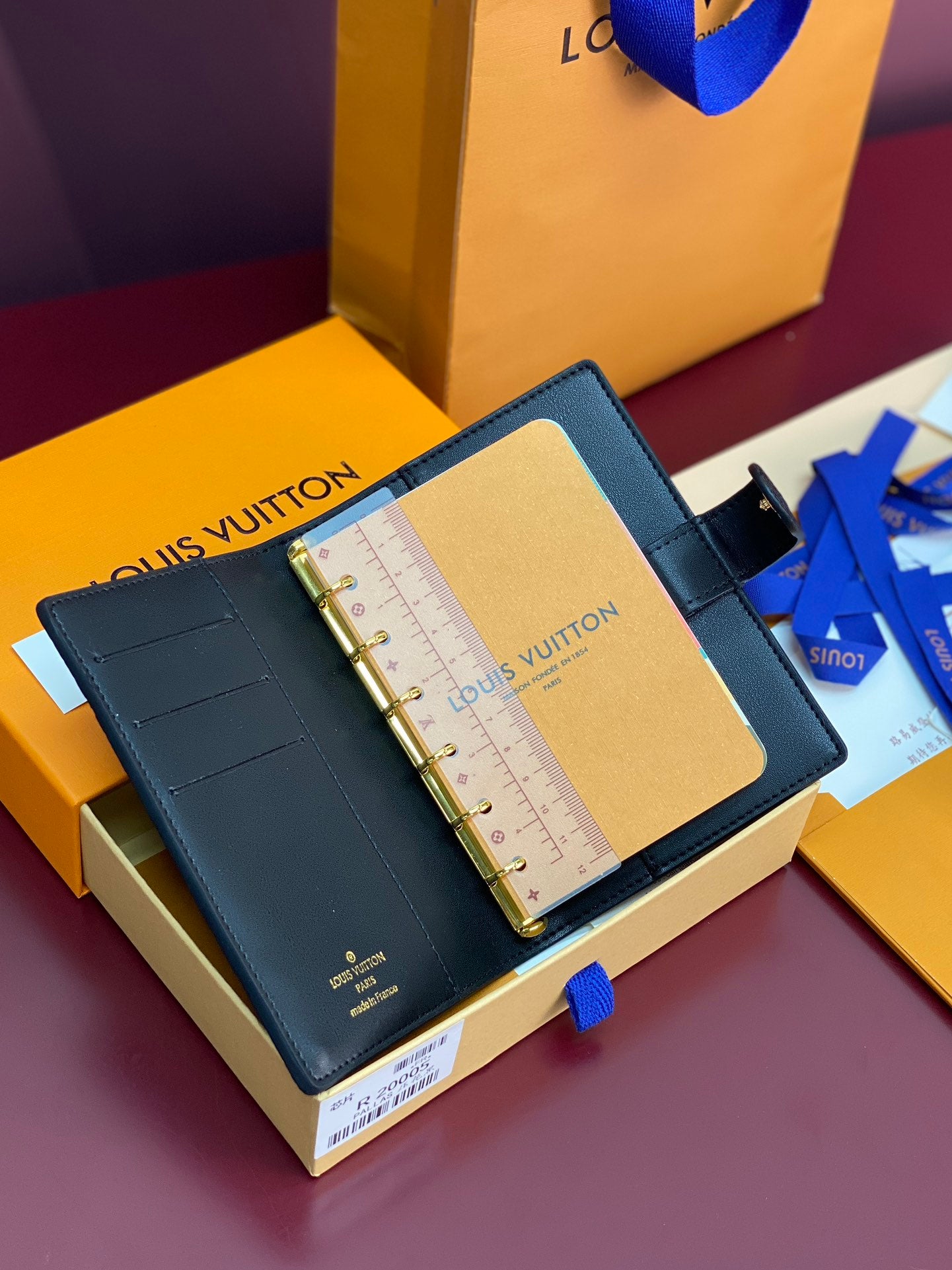 Small Louis Vuitton leather organizer, open with ruler insert, blue