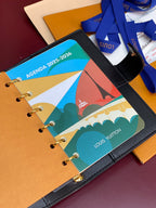 Small Louis Vuitton leather agenda with printed insert and gold rings