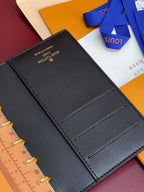 Small Louis Vuitton leather card slots page, dark blue, open
