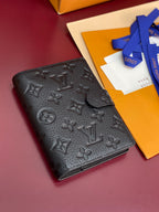 Small leather wallet with Louis Vuitton monogram, black, textured front