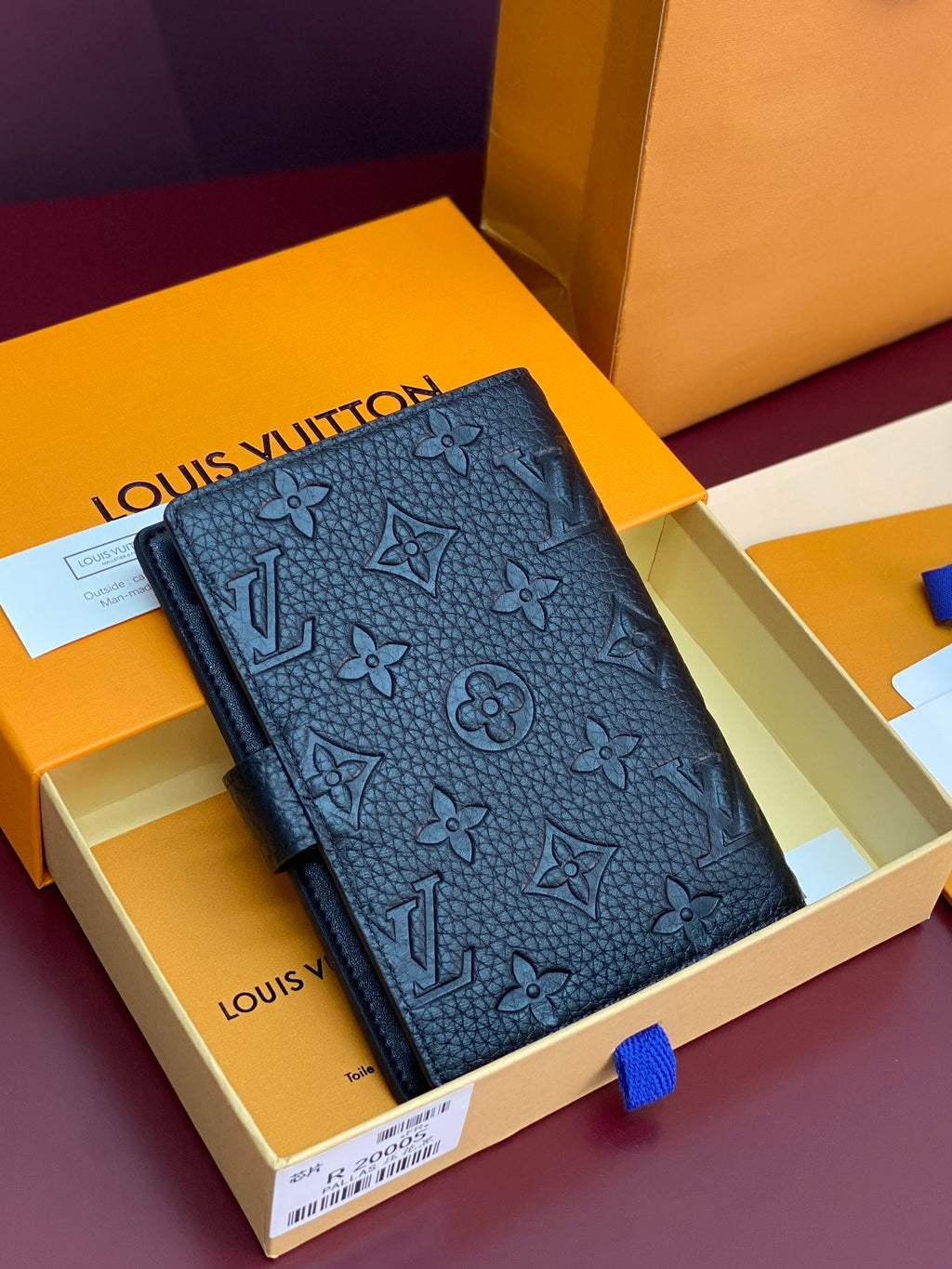 Small Louis Vuitton monogram leather wallet, dark blue, front view