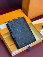 Small Louis Vuitton monogram leather wallet, dark blue, front view