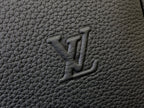 Louis Vuitton embossed monogram on textured dark gray leather