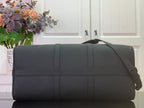 Louis Vuitton men’s duffel bag in dark leather with shoulder strap and stitched panels