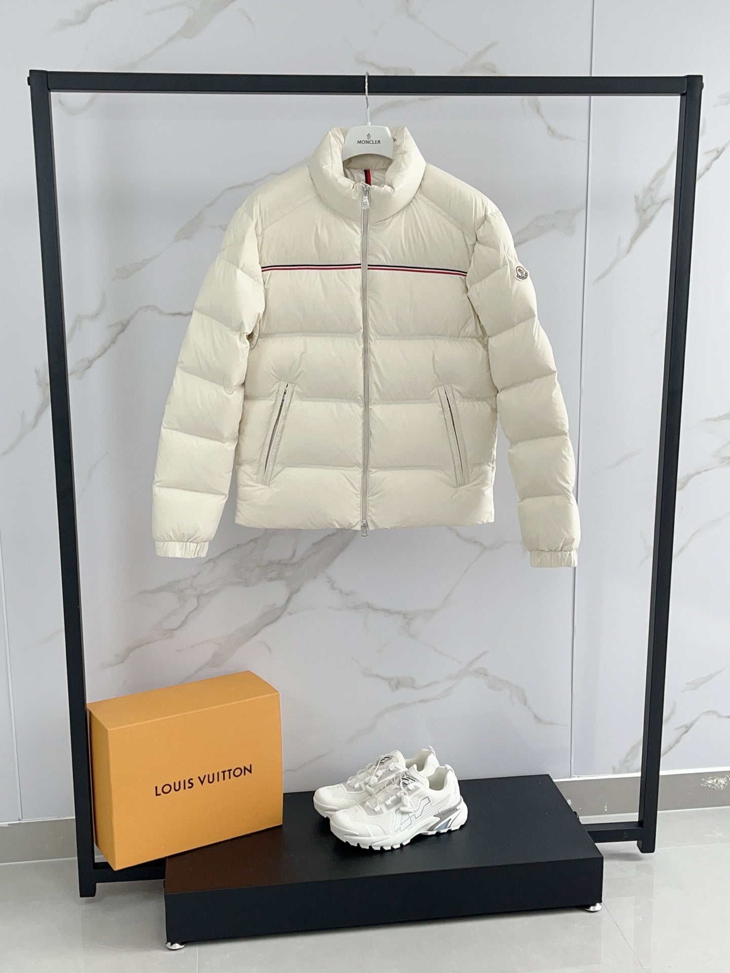 Moncler cream puffer jacket front, full zip with red stripe across chest