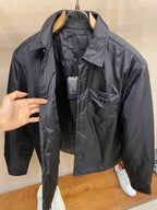 Dark Prada long-sleeve jacket front view with chest pocket and open collar