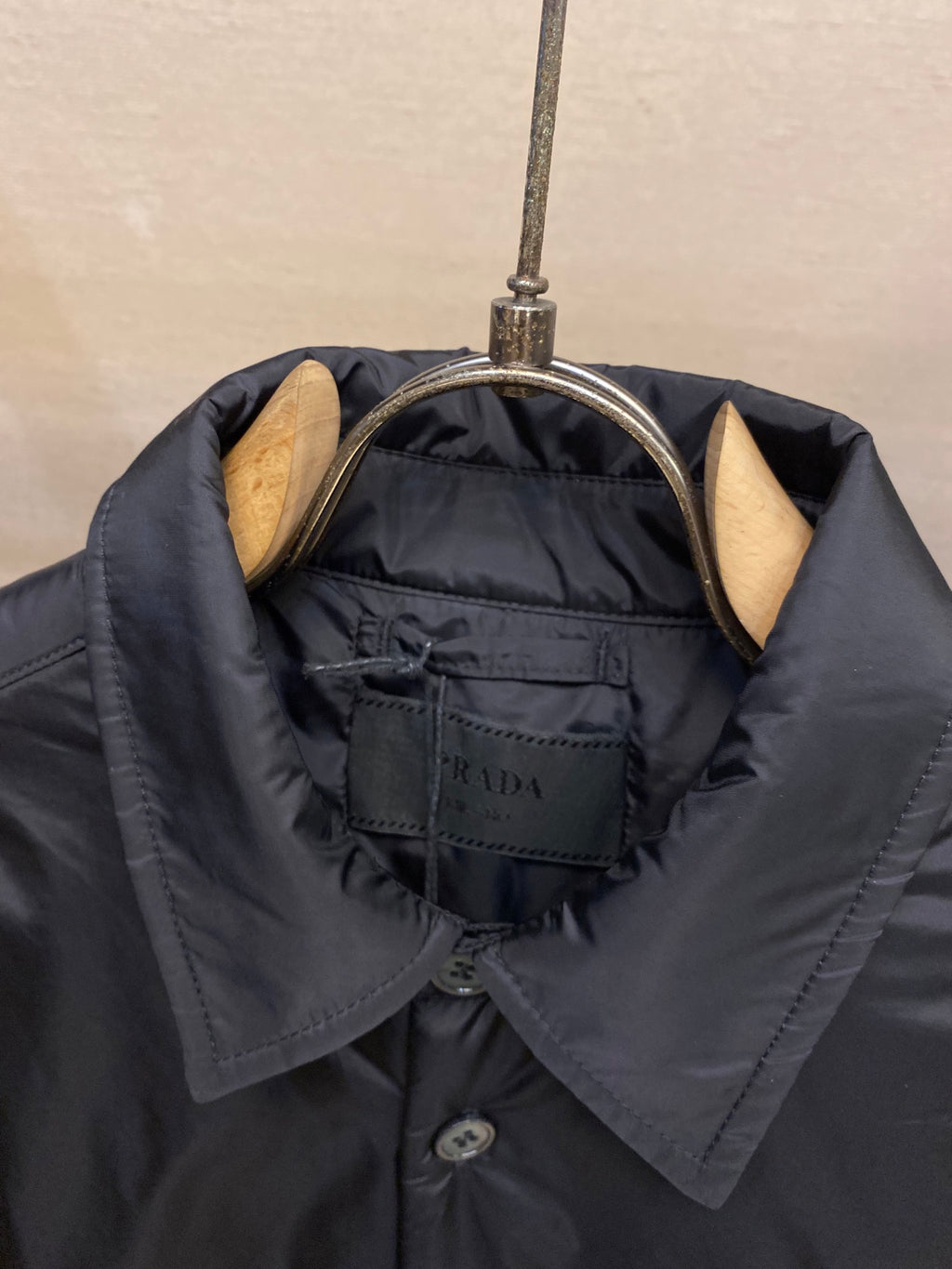 Prada long-sleeve jacket collar lining with brand label close-up