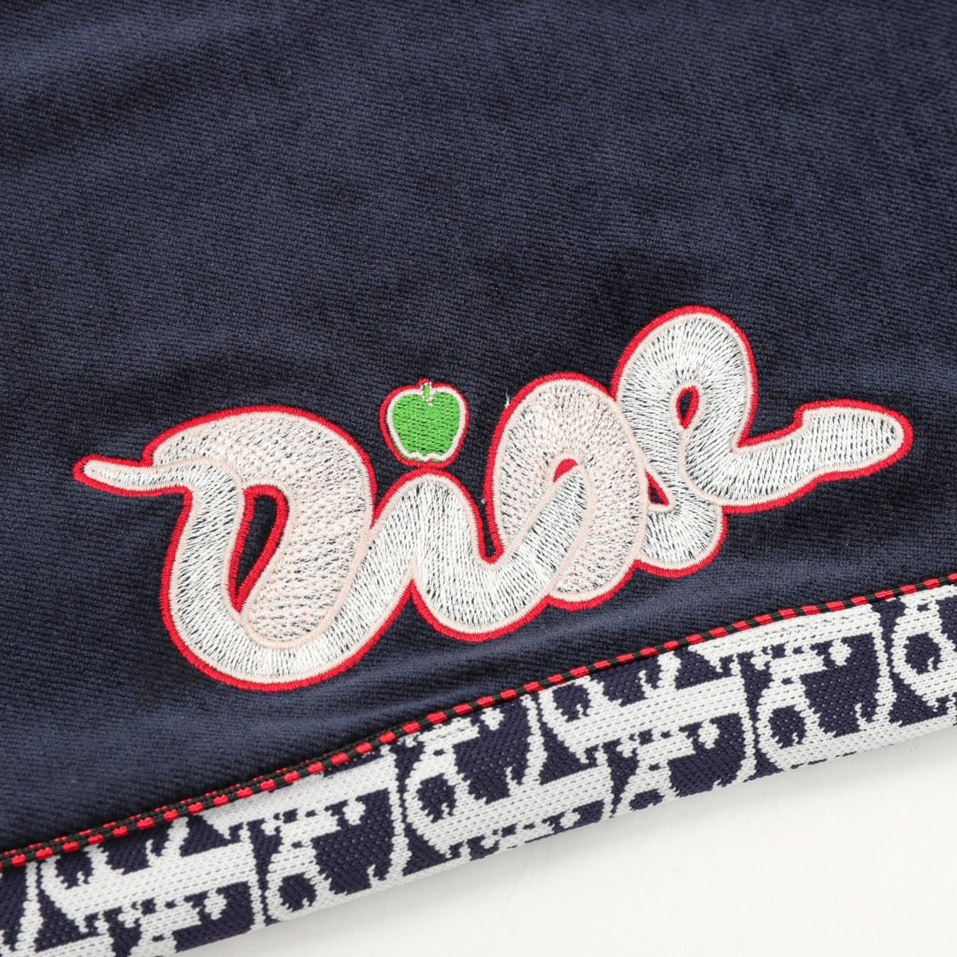 Navy pants with embroidered multicolor "Dior" script logo on the leg