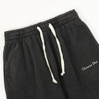 Black jogger waistband with drawstring cords and Christian Dior logo