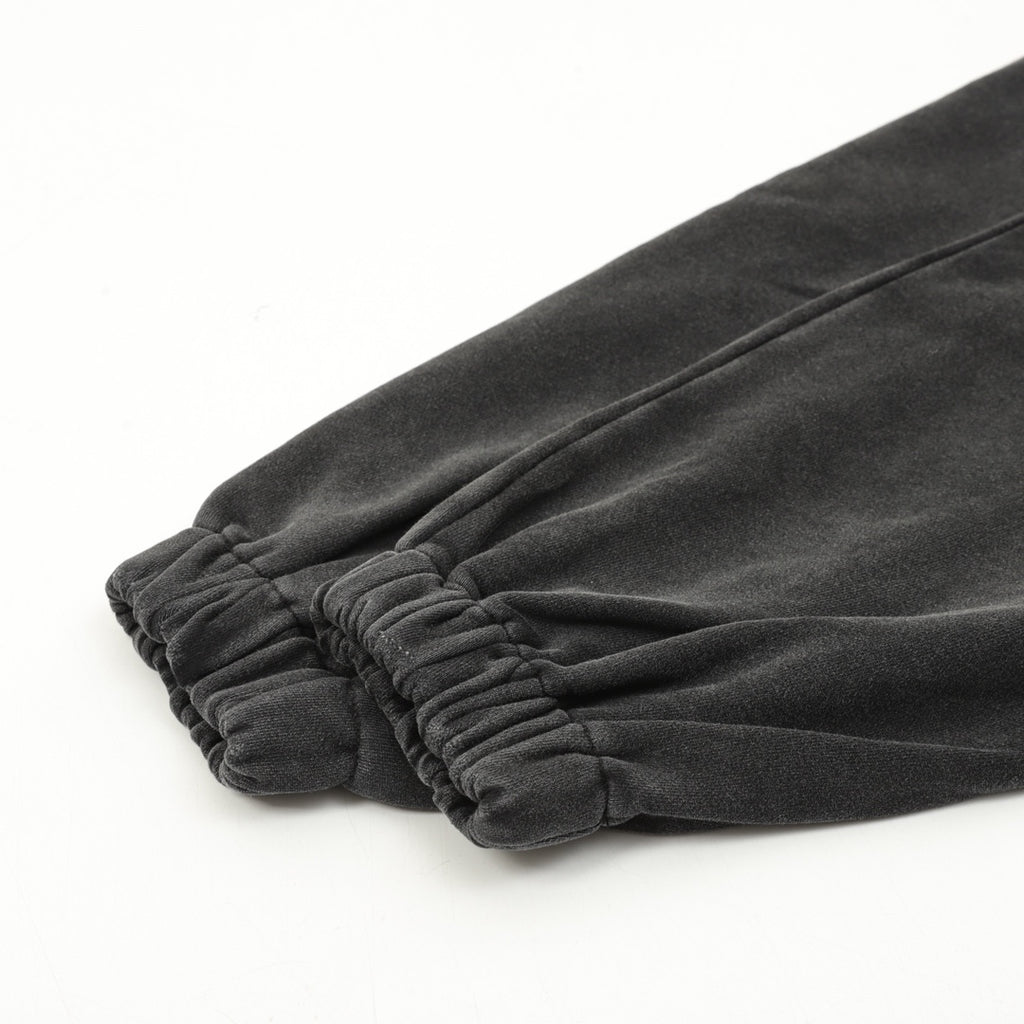 Black cuff hem with elastic gathered fabric