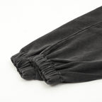 Black cuff hem with elastic gathered fabric