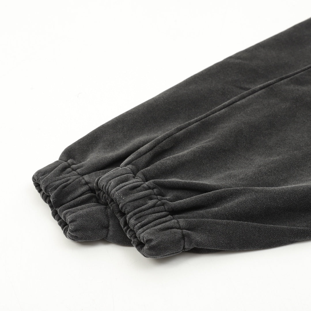 Black cuff hem with elastic gathered fabric