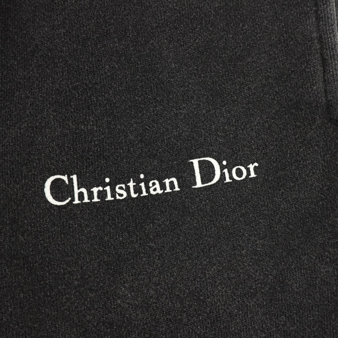 Christian Dior logo on black pants fabric