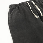 Black pants with elastic waistband and drawstring cords