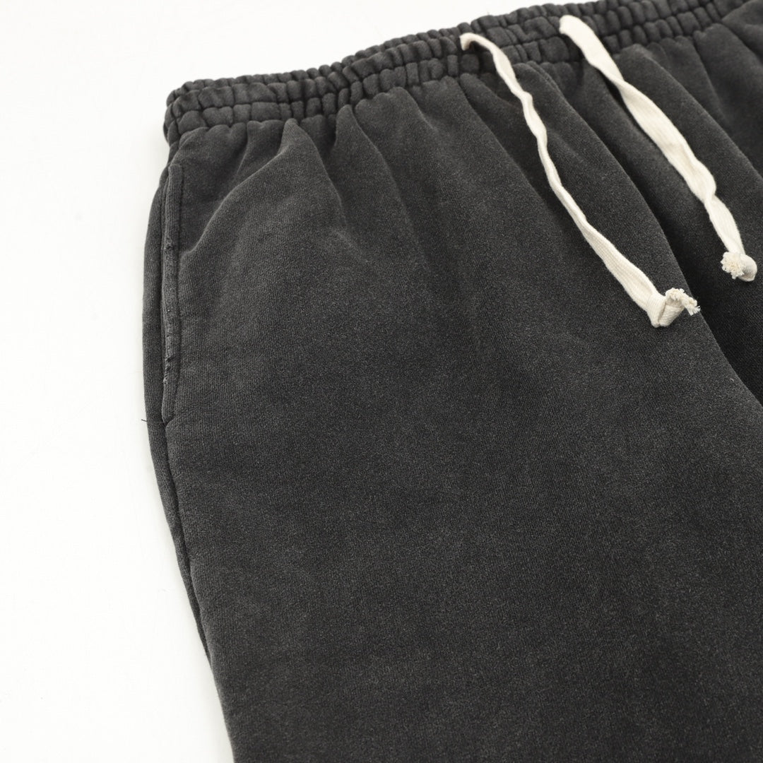 Black pants with elastic waistband and drawstring cords