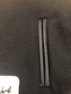 Black jacket placket with vertical stitched trim and inner reinforcement seam