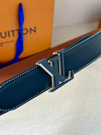 Louis Vuitton belt buckle, gold LV logo on dark navy leather strap with stitching.
