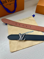 Louis Vuitton belts, tan and dark navy leather straps with silver-toned buckle.
