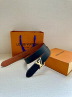 Navy and brown leather belts with gold-tone LV buckle, angled view