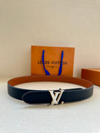 Leather belt with dark navy strap, tan lining, and gold LV buckle