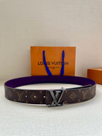 Louis Vuitton belt with dark monogram strap and gold LV buckle, purple inner lining.
