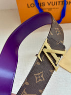 Monogram belt strap close-up with purple lining and gold-tone buckle detail