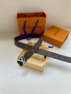 Monogram belt with purple strap and gold LV buckle, top view