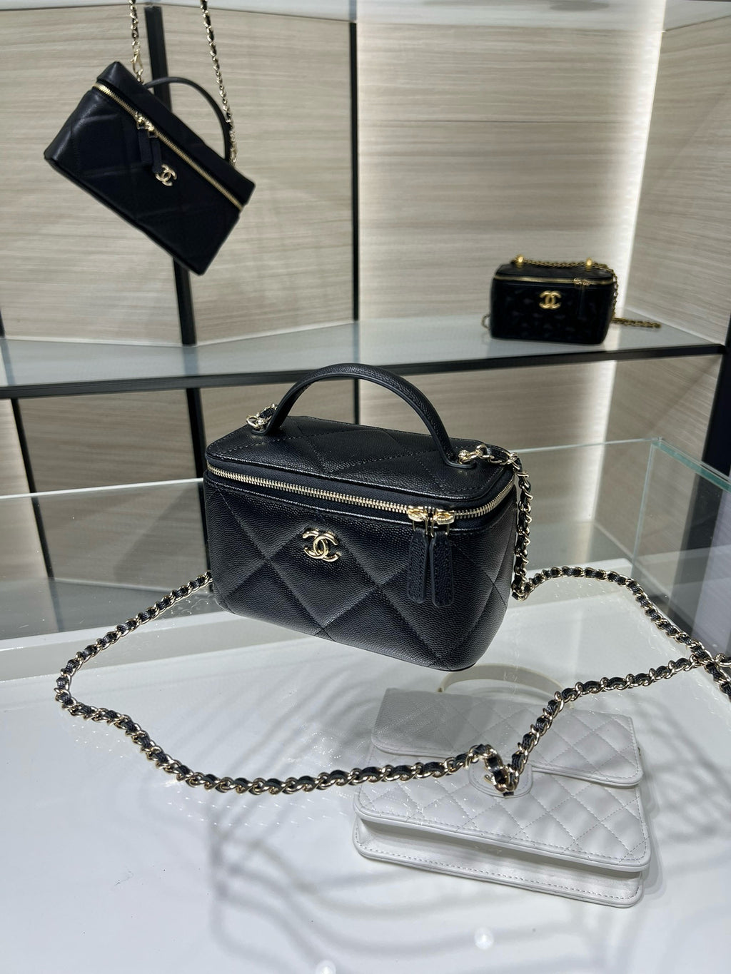 Chanel quilted mini bag with chain strap and top handle, dark leather, gold zipper
