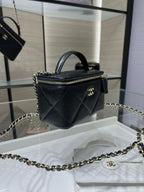 Chanel mini bag with chain strap, quilted dark leather, gold CC clasp and handle