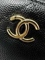 Chanel CC metal logo on dark textured leather