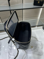 Chanel bag with open top and chain strap, dark interior, gold hardware and zipper