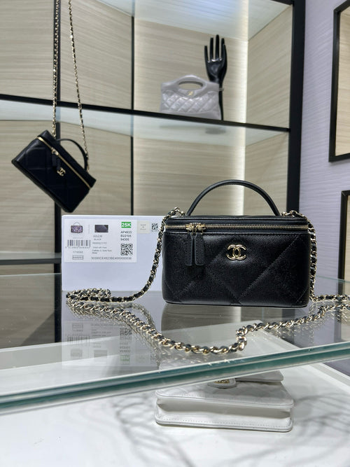 Chanel bag with chain strap, quilted exterior and gold logo clasp, dark leather