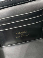 Chanel bag interior label reading 'CHANEL MADE IN FRANCE' on dark leather