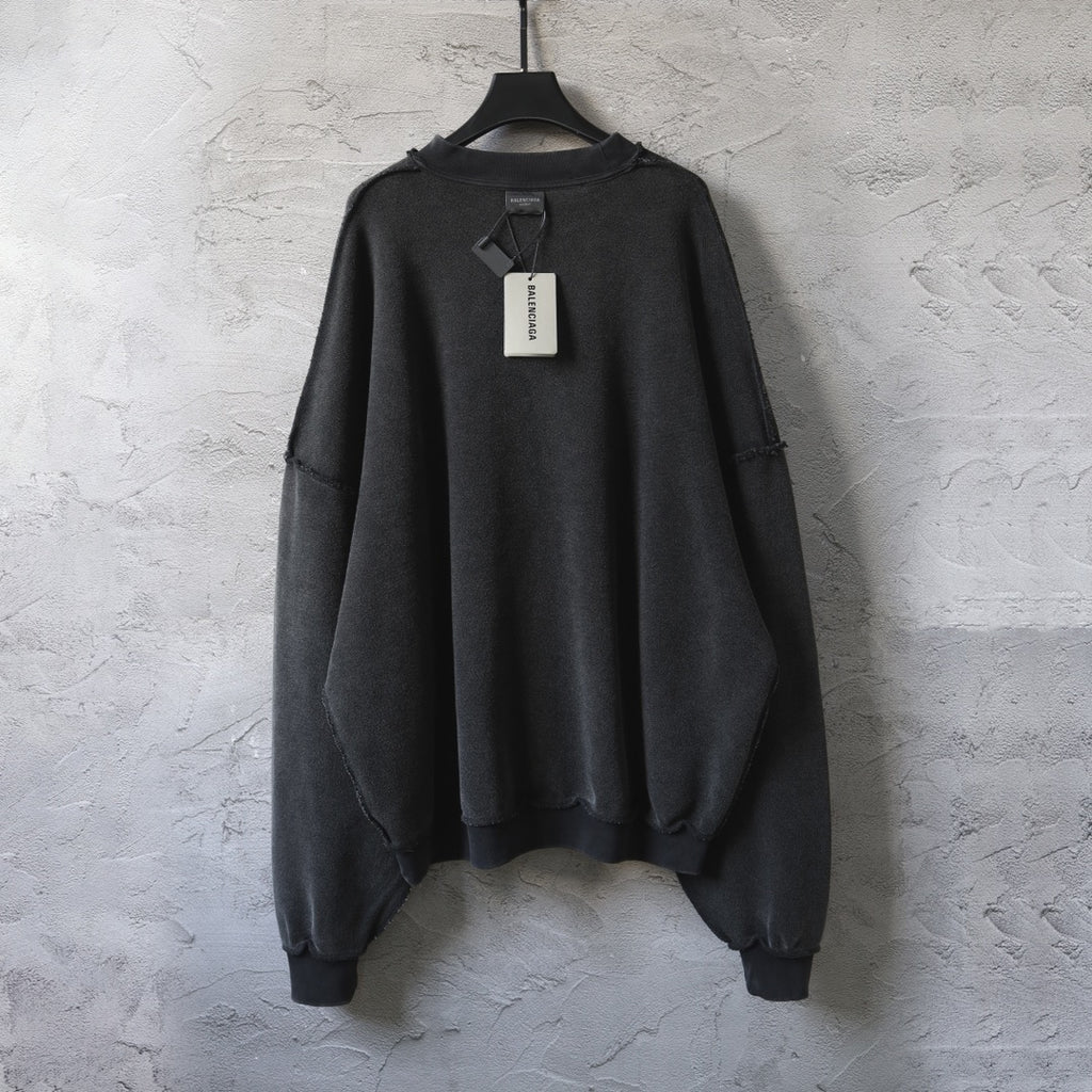 Balenciaga black long-sleeve sweatshirt, back view with neck tag